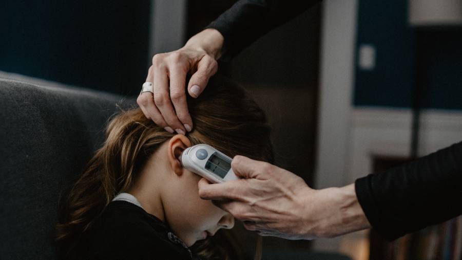 Can an employee attend work if their child is sent home from school due to COVID-19?