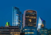 Private sector pay rises climb to 3.4 percent as cost of living pressure persists A view of the London City financial district at night.