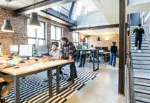 HR fine risk rises as new enforcement agency launches amid low awareness People working at desks in an open-plan office.