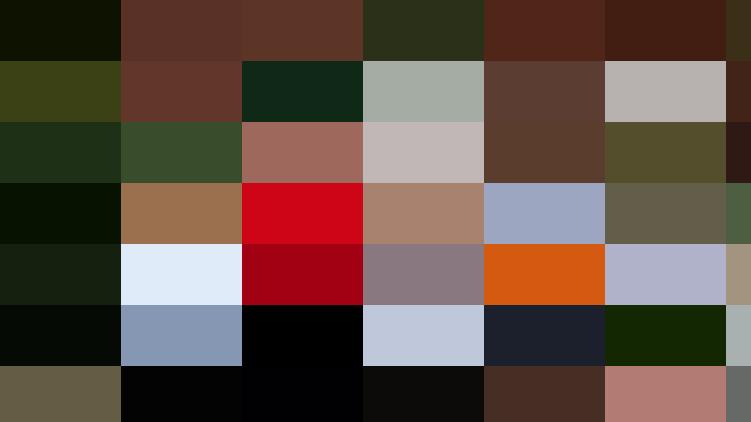 Group of nine personnel, some in cycling gear, posing with bicycles in front of a building labeled 