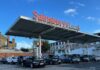 Britain’s biggest retailers cut 18,000 jobs as employment costs rise Cars parked under a Sainsbury's supermarket sign.