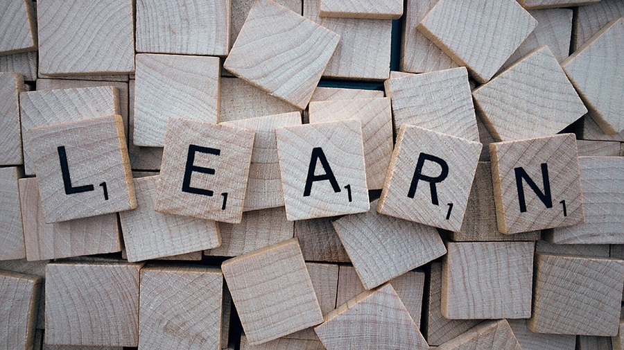 Wooden Scrabble tiles arranged to spell 