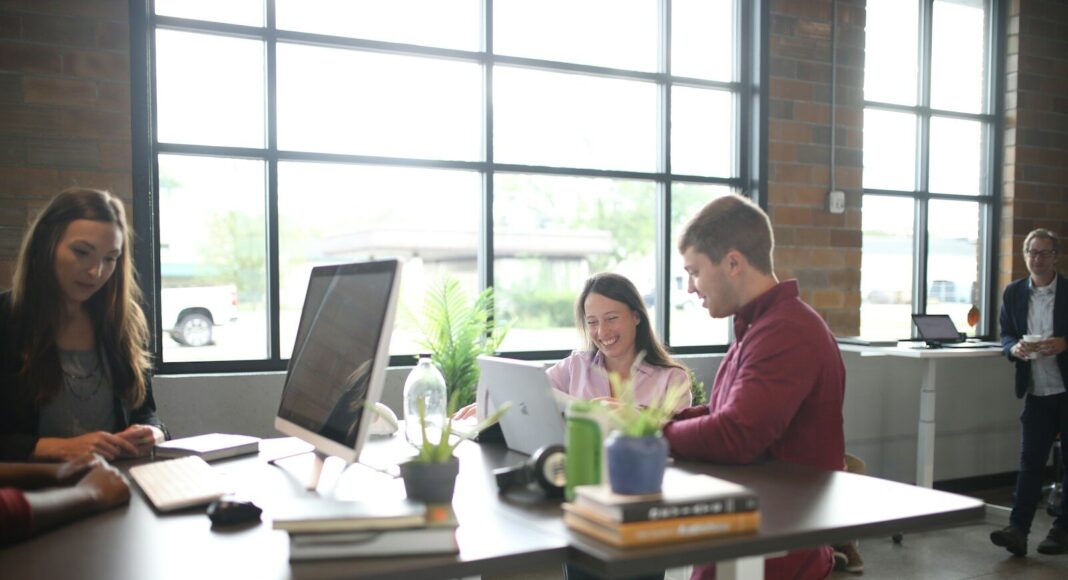 People working on an open-plan office,