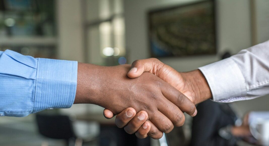 Two people shaking hands.