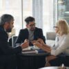 Business executives meeting around a table.