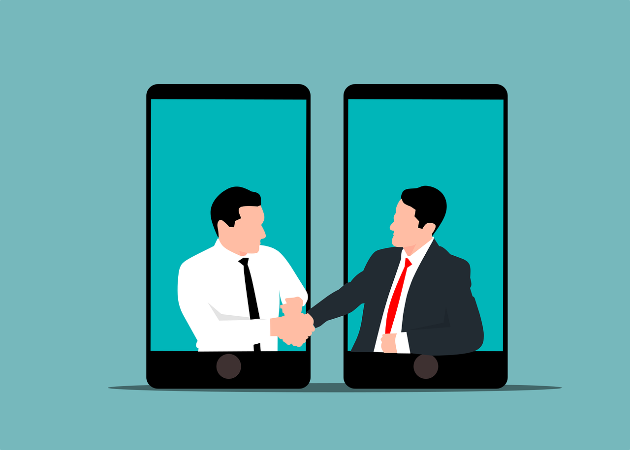 Illustration of two businesspeople shaking hands through smartphone screens against a blue background, symbolizing virtual agreement or remote collaboration amidst the great resignation.