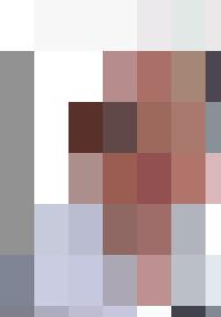 A man in glasses provides guidance and encouragement to employees in a white shirt.