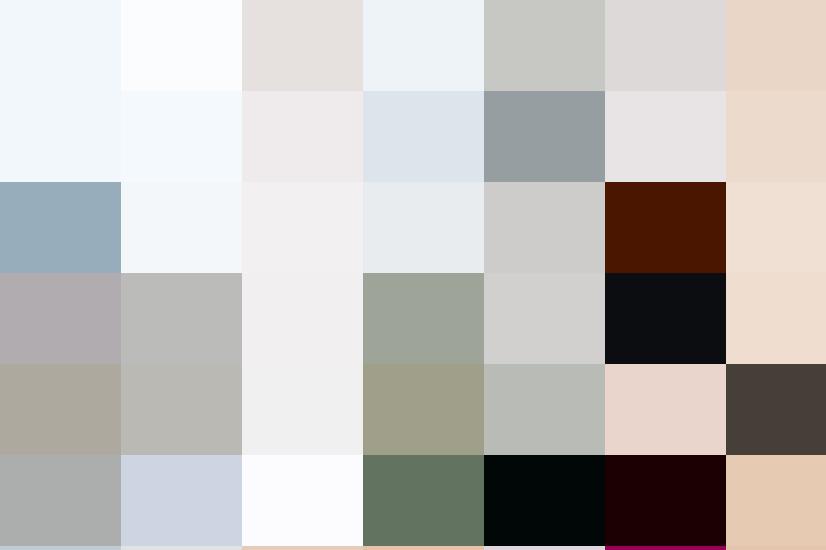 A woman holding a book in front of a window.