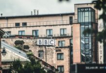 BBC job cuts ‘risk legal fallout’ if consultation and communication fall short BBC logo on a building during daytime.