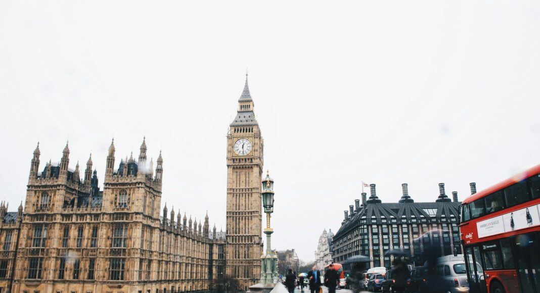 People walk near Big Ben in London.