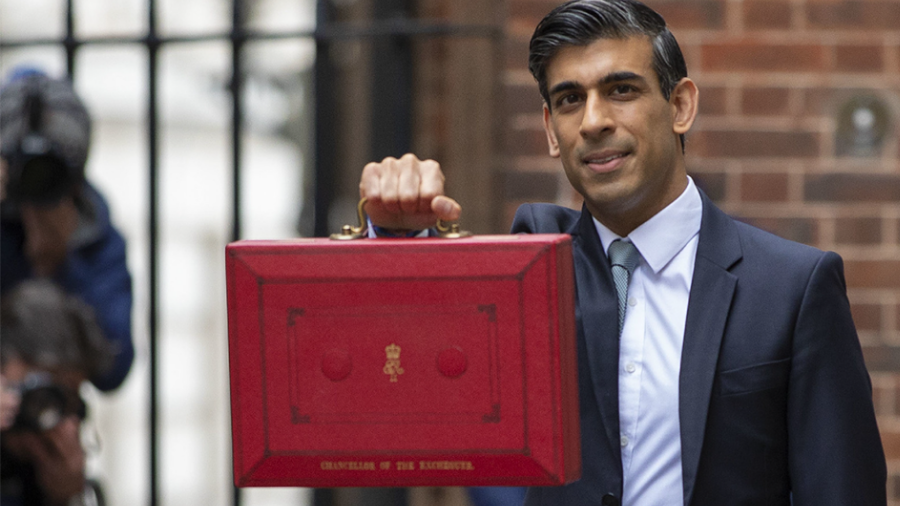 A person in a suit holds up a red briefcase with the text 