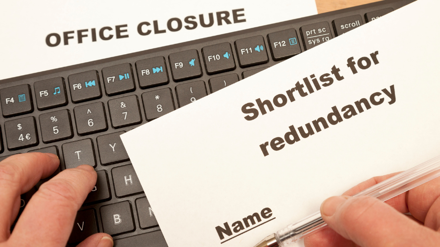 A person's hands are placing a document labeled 