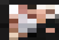 A group of people in tuxedos posing for a picture during a personnel gathering.