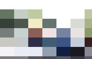 A group of personnel standing next to a boat on a lake.