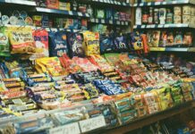 Biscuit break or energy crash? Junk food blamed for workplace energy slumps A shop display filled with lots of different types of snacks.