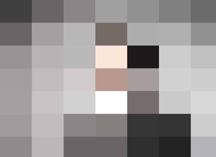 A businessman in a suit is looking at the camera, focusing on workforce planning.