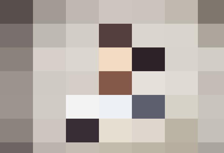 A enterprising young boy from Burnley, wearing glasses, gives a thumbs up.