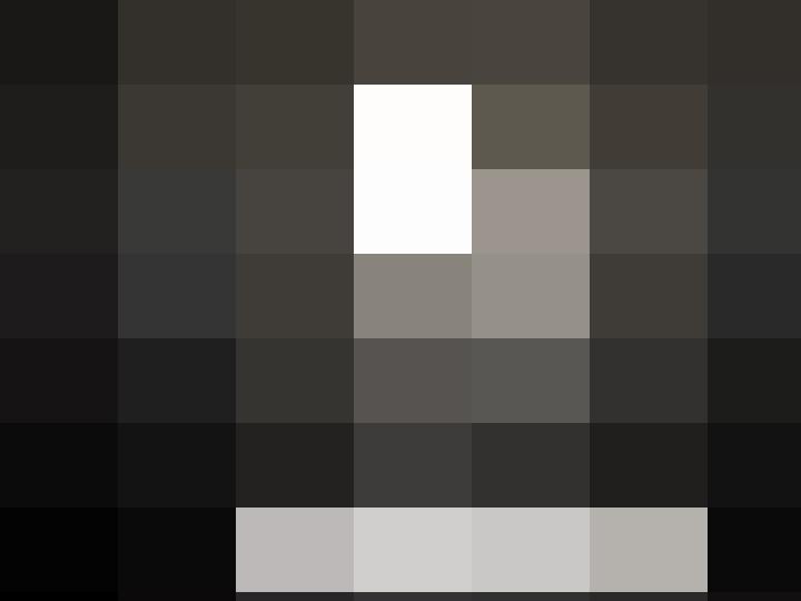 A prison cell with a light shining through the bars.