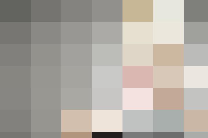 A woman is putting her hand on her mouth.