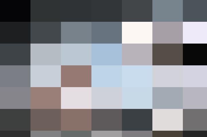 A man sitting in front of a pile of papers, attempting to save money.