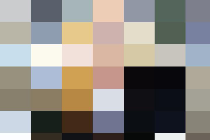 A woman in the UK working at a table with a laptop.