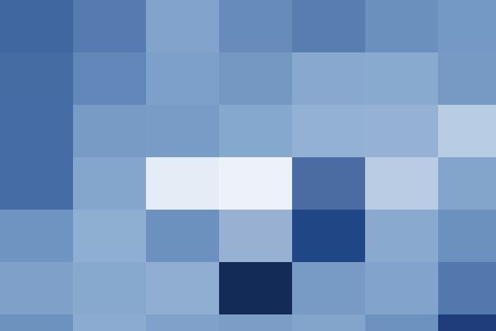 A person walking down a conveyor belt in a manufacturing factory.