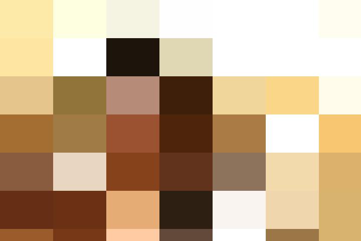 A young Asian woman creating a new UK job smiles at the camera.