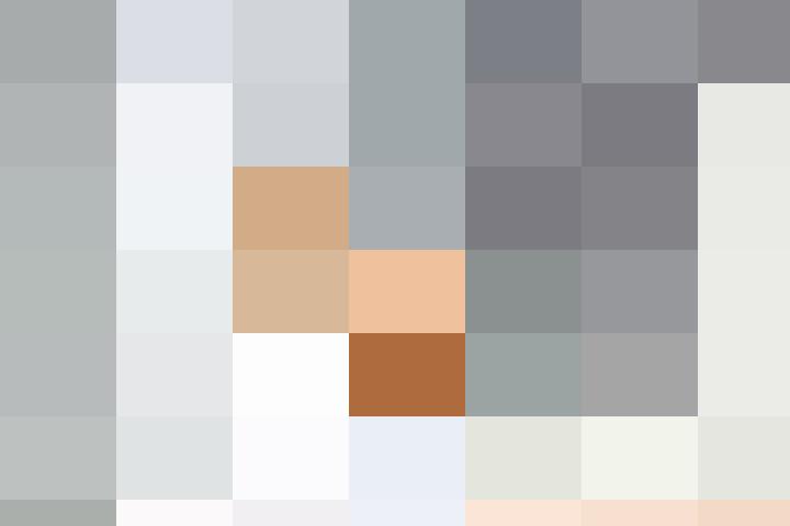 A woman using a laptop at her desk.