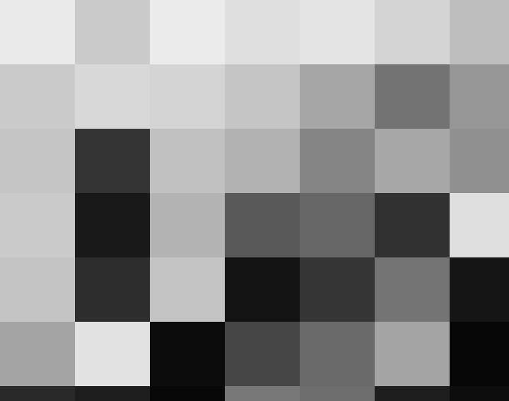 A leader in a suit speaking on the phone.