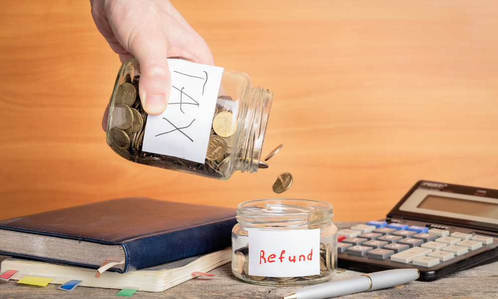 A hand pours coins from a jar labeled 