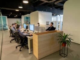 £30bn pension savings window opens for employers ahead of 2029 reforms A group of people sitting at desks in an office.