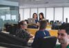 Workers fear favouritism is driving workplace rewards and recognition People at work in an office.
