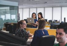 Workers fear favouritism is driving workplace rewards and recognition People at work in an office.