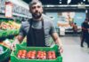 Food workforce crisis deepens as labour shortages threaten supply and service A grocery store worker holds a box of tomatoes.
