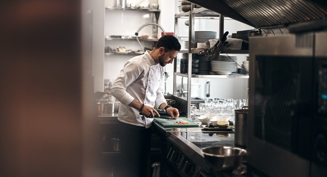 A chef working in a kitchen.