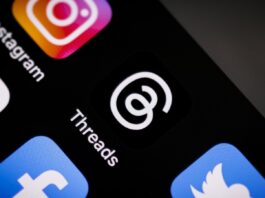 Meta eyes cuts of up to 20 percent as AI drive reshapes workforce A close up of a mobile phone with social media icons.