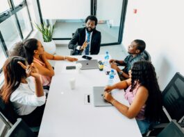 Pay decisions under strain as managers admit fairness doubts A group of people sitting around a white table.